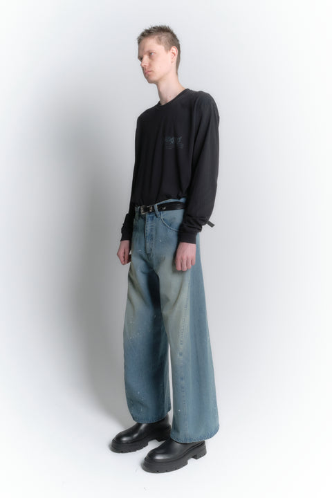 AGING TWISTED DENIM PANTS