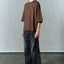 AGING TWISTED DENIM PANTS